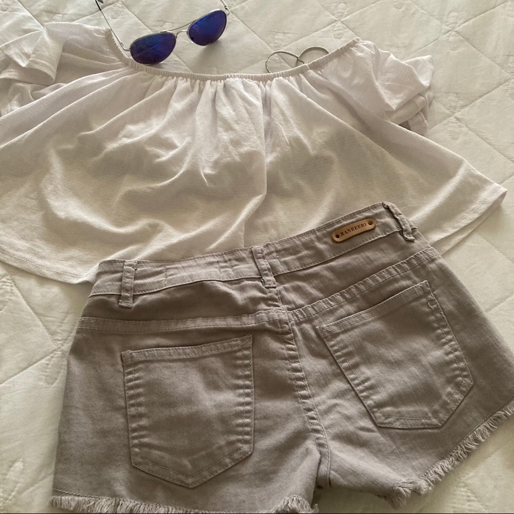 Light gray shorts with a floral pattern in fabric